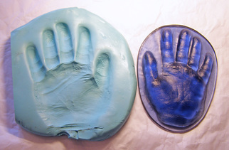 hand print casting taken from impression in putty 