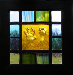 hand and foot stained glass panel